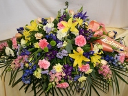 Sympathy Casket Spray Multi-color from Mischler's Florist and Greenhouses in Williamsville, NY